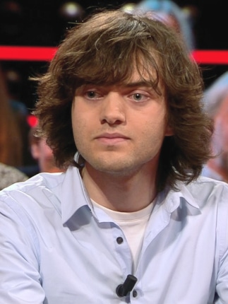 Image of climate action advocate, Boyan Slat, wearing a light blue shirt and looking off camera